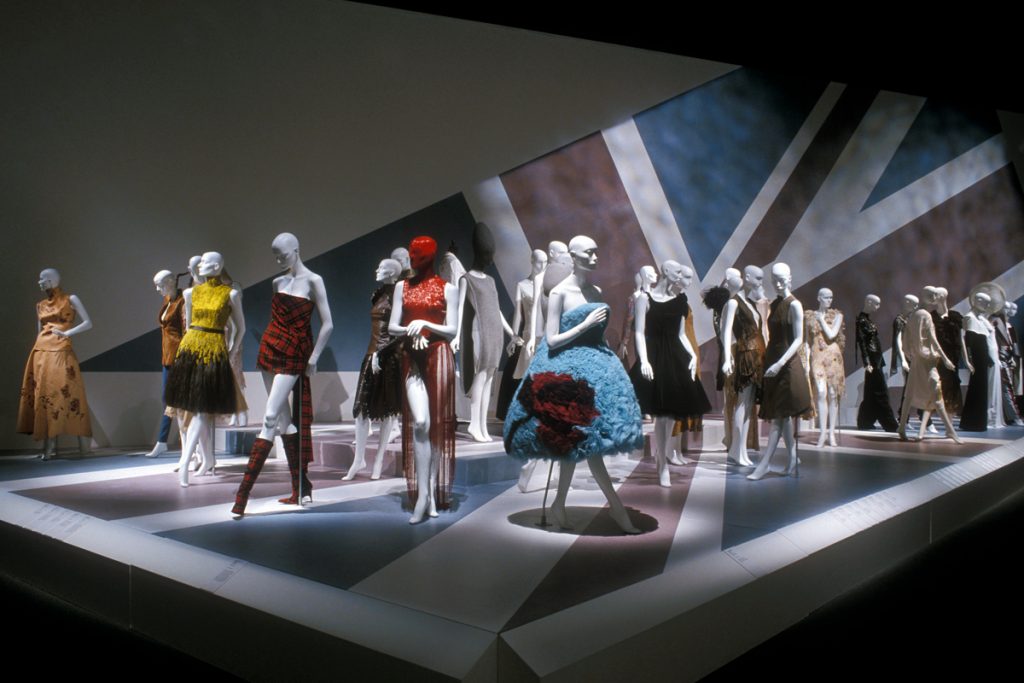 Exhibition display of feminine garments with a Union Jack flag as background