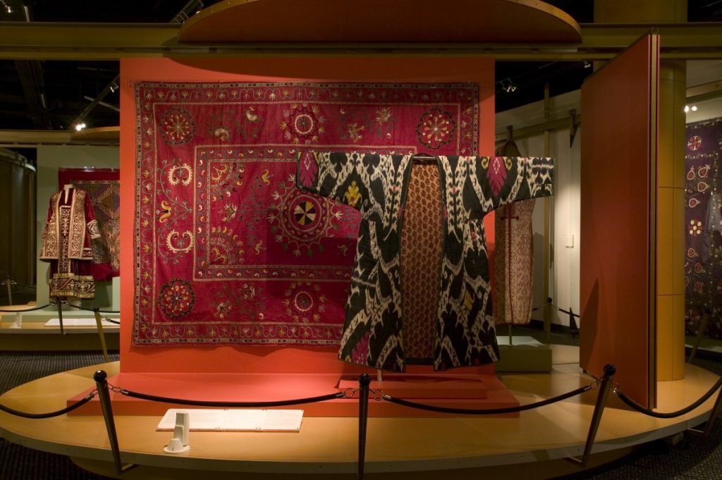 Asian style garment displayed in front of carpet