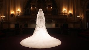 Exhibition display ofwhite wedding dress with long train
