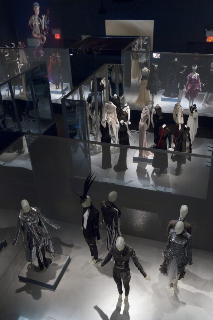 Exhibition display of dressed mannequins (seen from above)