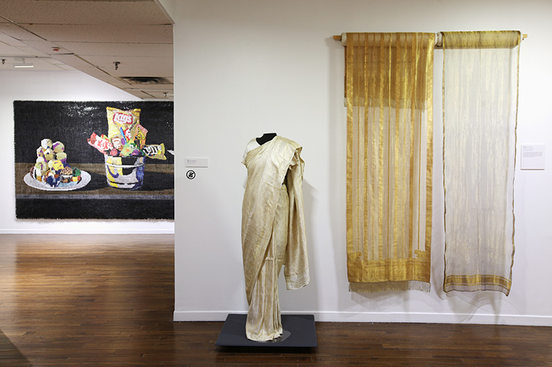 Exhibition with traditional garments on display.