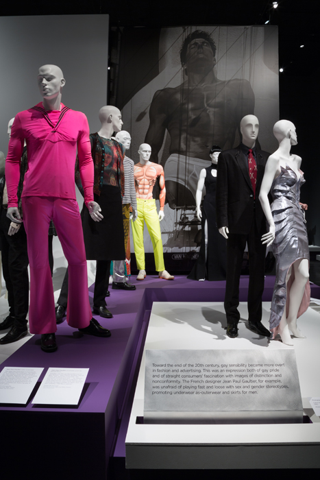 Exhibition display of dressed mannequin and image