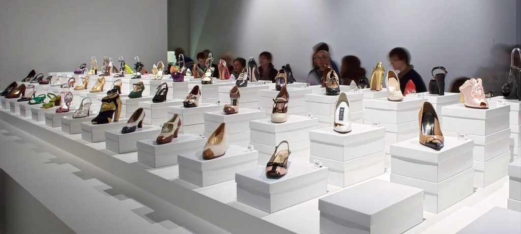 Exhibition display of shoes on boxes