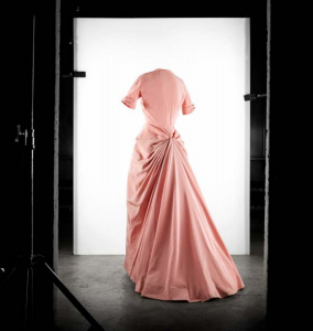 Exhibition display of dressed mannequin in pink dress