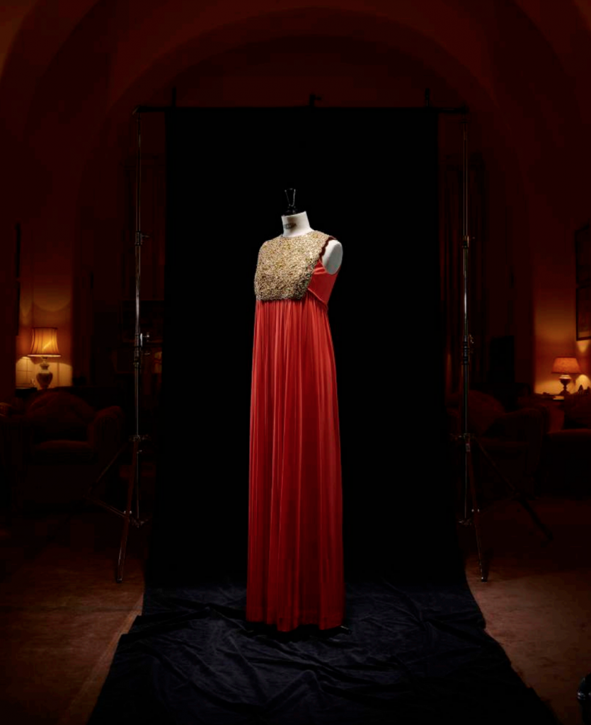 Exhibition display of dressed mannequin in red dress