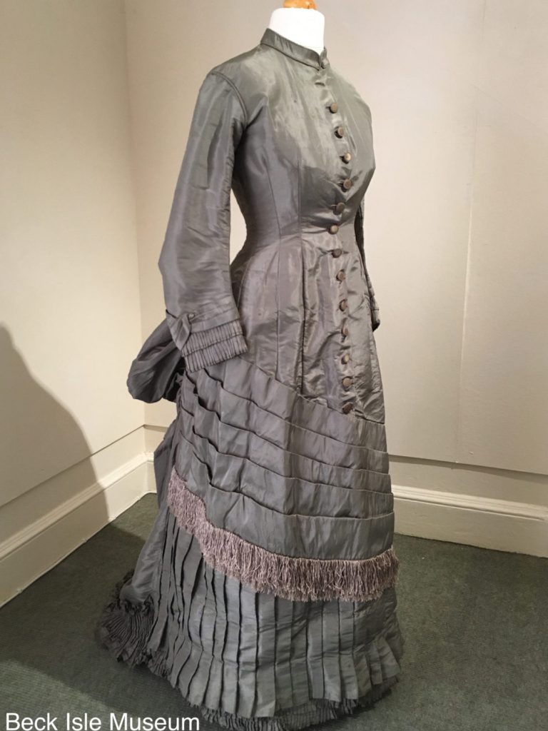 Exhibition display of dressed mannequin in Victorian dress