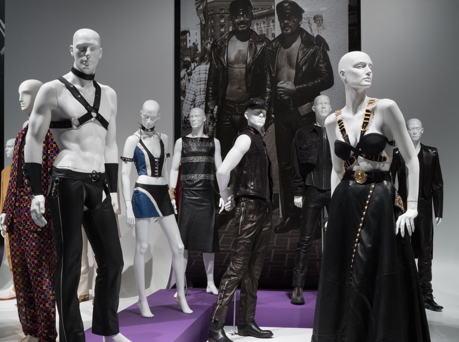 Exhibition display of dressed mannequins with image