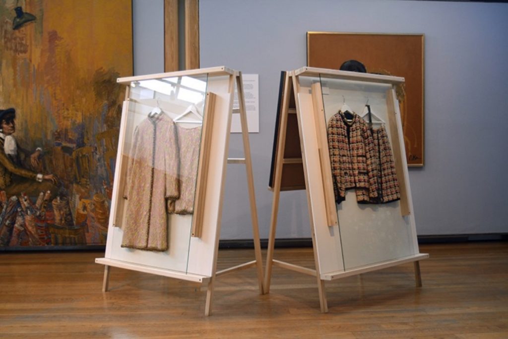 Exhibition display of garments in A frames