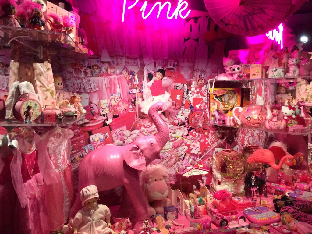 Exhibition display of pink ephemera