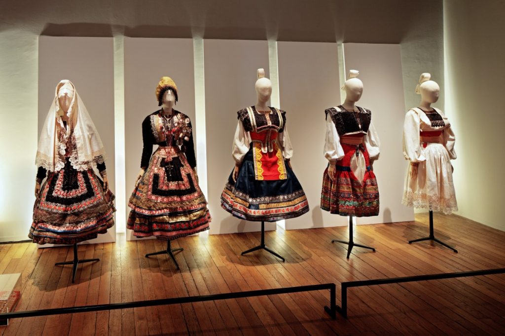 Exhibition display of dressed mannequins in traditional clothing