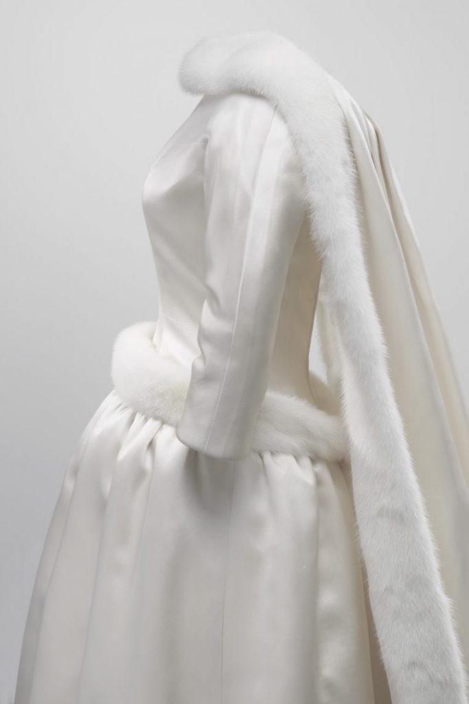 Exhibition side view of dressed mannequin in wedding dress
