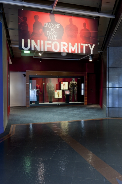 Exhibition entrance including banner with exhibition title