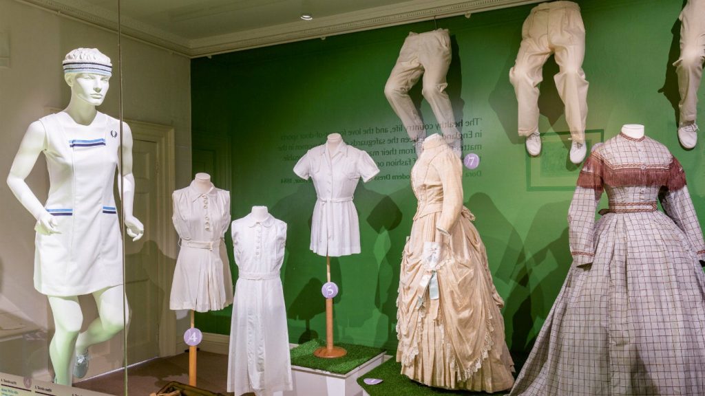Exhibition display of dressed mannequins in tennis gear through the ages