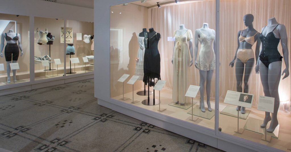 Exhibition display of dressed mannequins in underwear