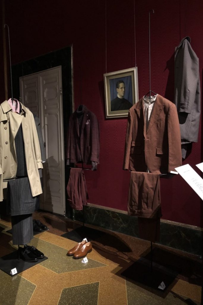 Exhibition display of hanging menswear suits