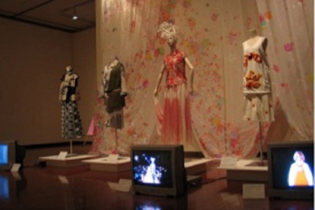 Exhibition display of dressed mannequins and films