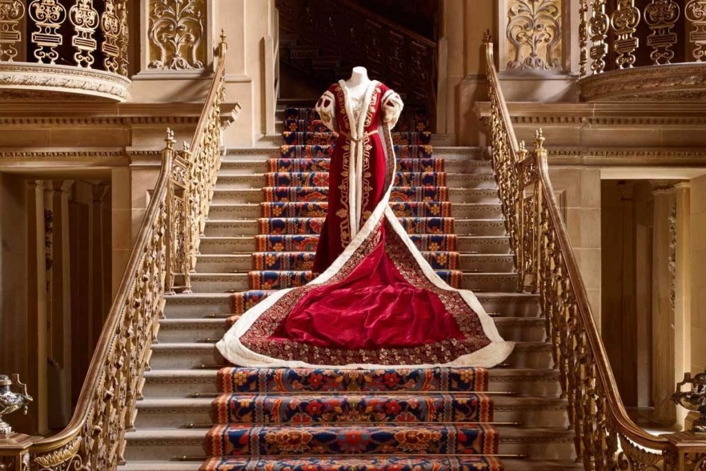 Exhibition display of dressed mannequin on stairs