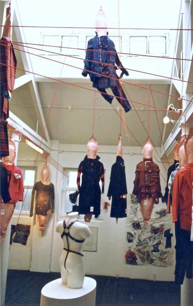 Exhibition display of dressed mannequins suspended