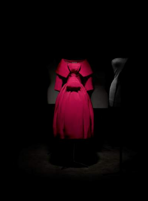 Exhibition display of red dress on mannequin