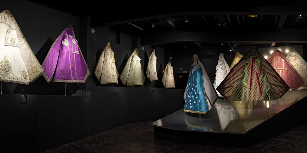 Exhibition display of underlit skirts, tent-shaped