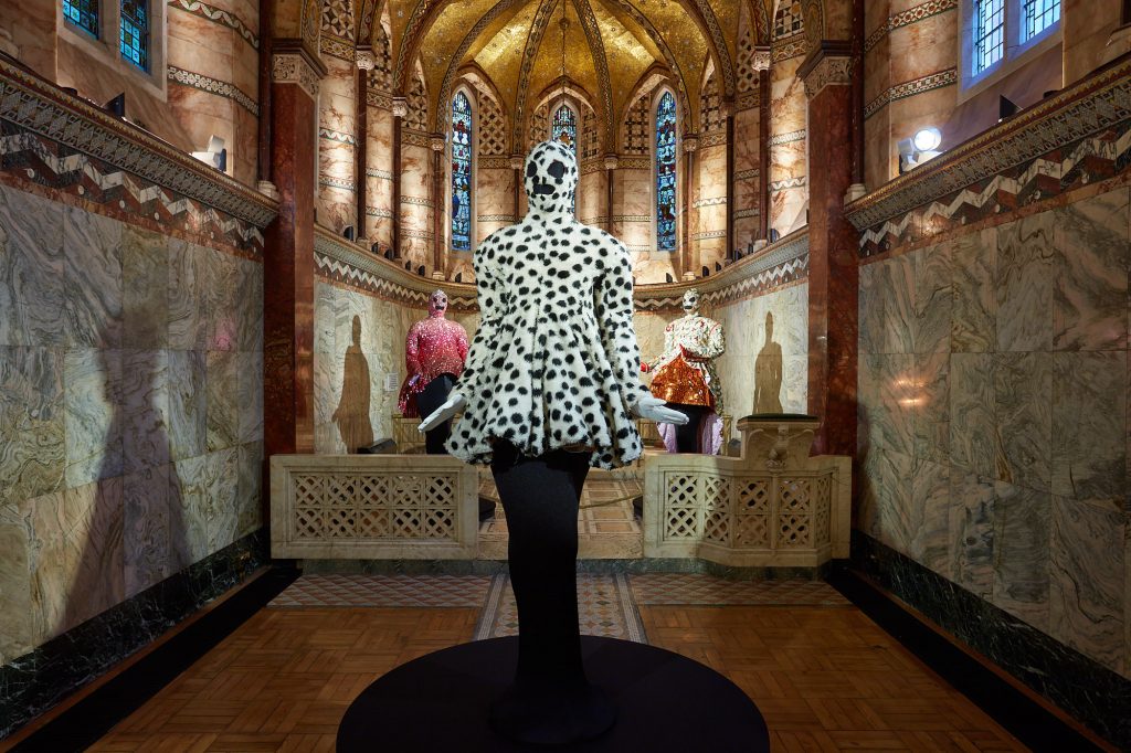 Exhibition display of dressed mannequin of Leigh Bowery in spotted top