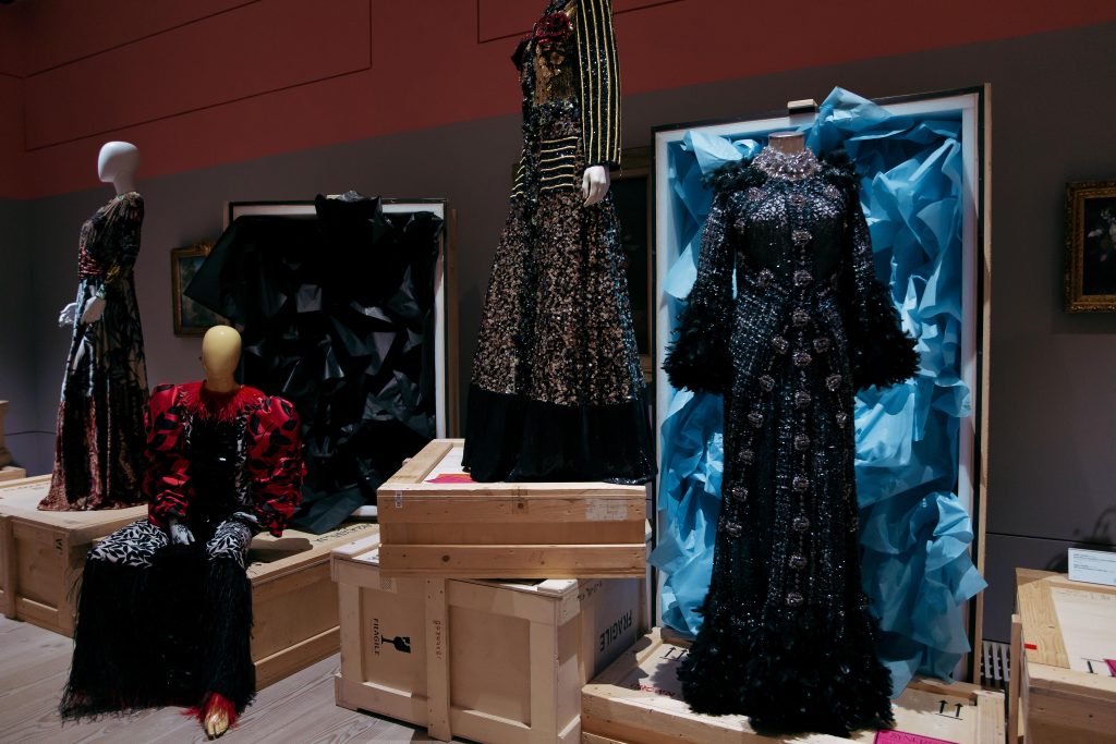 exhibition mannequins amongst art pieces
