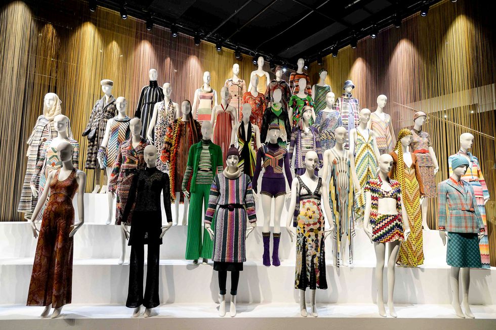 A display of Missoni outfit on white mannequins staggered on a pyramid-style platform