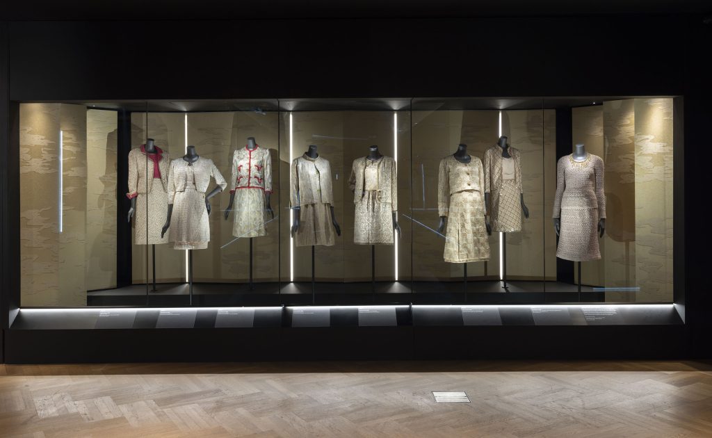 A gallery view showing eigh cream and beige Chanel embroidered and silk outfits.
