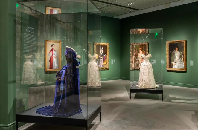 Installation view of ‘Fashioned by Sargent’ exhibition at the Museum of Fine Arts, Boston. Blue and white dresses.