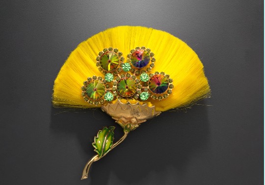 Hattie Carnegie, silk flower brooch, 1960–69. Gilt metal, enamel glass, silk. Gift of Carole Tanenbaum.