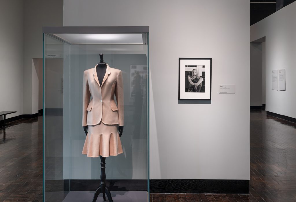 A female mannequin skirt suit all in white.