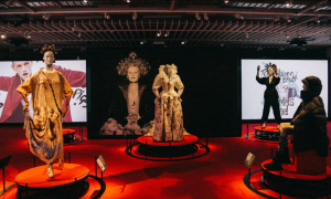 An installation of four female mannequins, all wearing hues of gold, white and black.