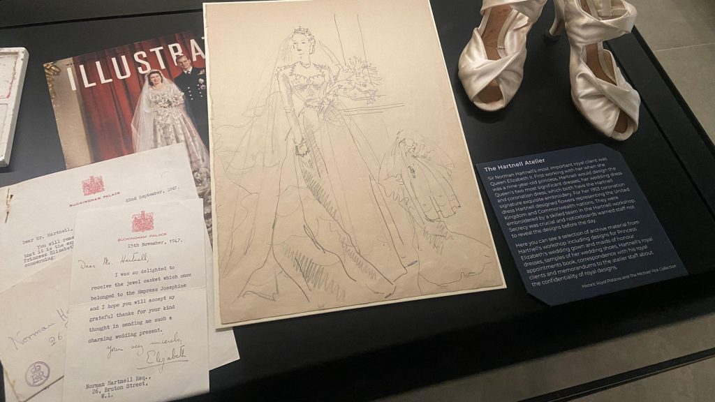 Ivory high heel shoes in a peep toe. Sketches of a female figure in a wedding dress and a wedding magazine.