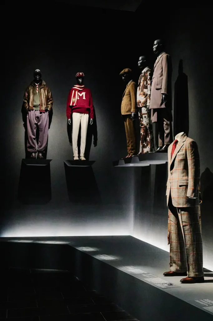 Menswear ranging from formal to casual wear in hues of red, brown, white and purple.