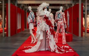 A collection outfits in hues of red, white and black.