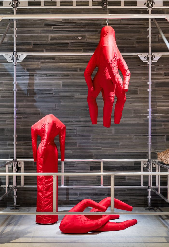 A collection of red garment like shapes.