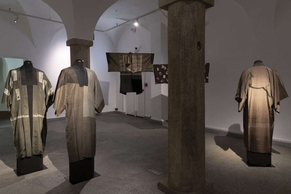 Three kimonos in hues of grey, beige and black.