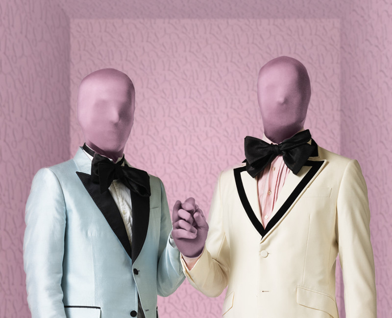 Two male mannequins wearing suits and bowties; in hues of green, pink, cream and black.