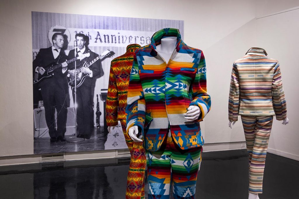A collection of multi-coloured suits.