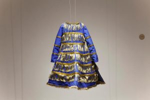 A dress in hues of blue and gold.