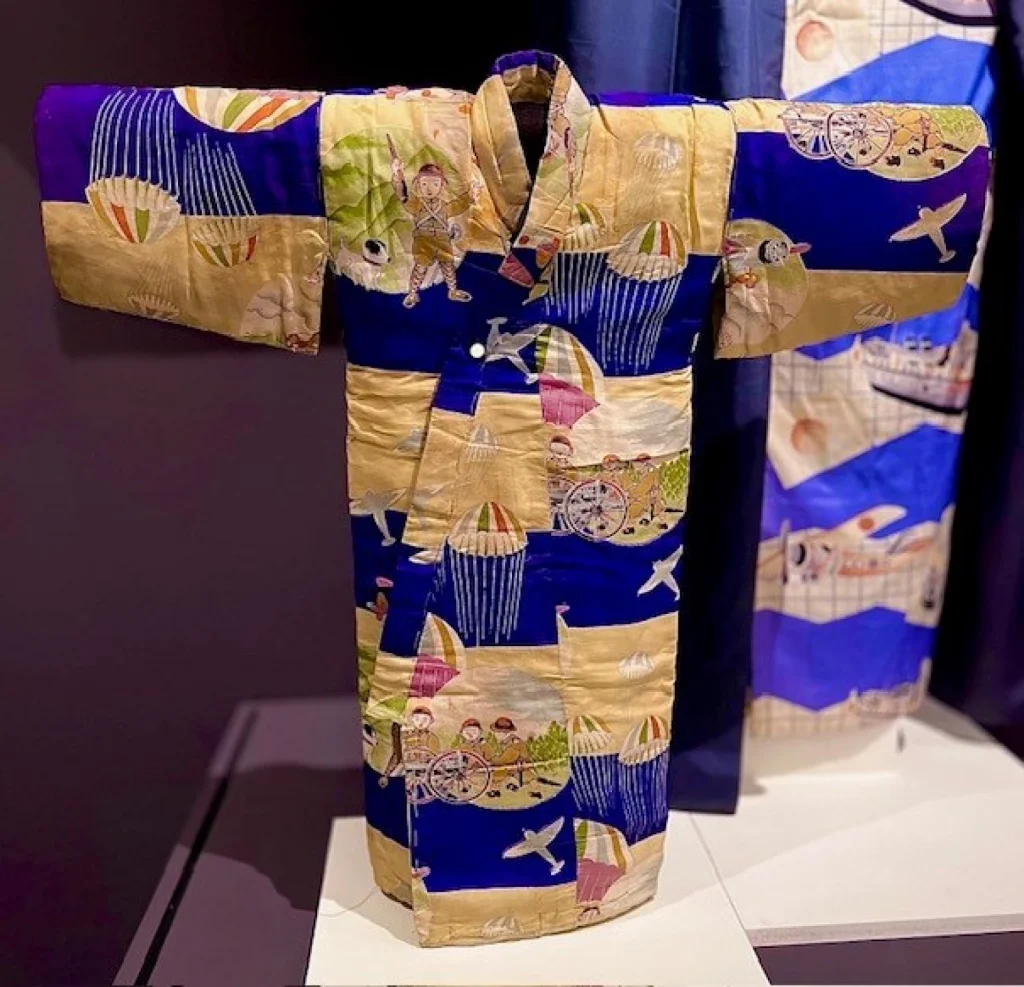 Quilted kimono with seaside pattern in hues of cream and dark blue.