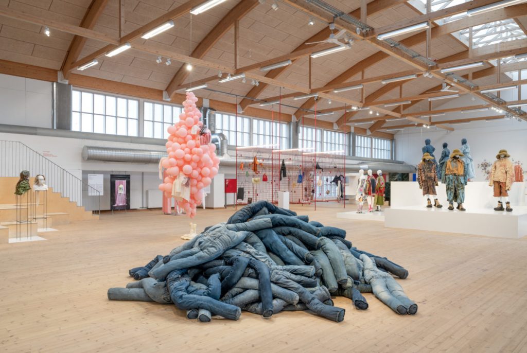 An installation made out of jeans in hues of blue denim.