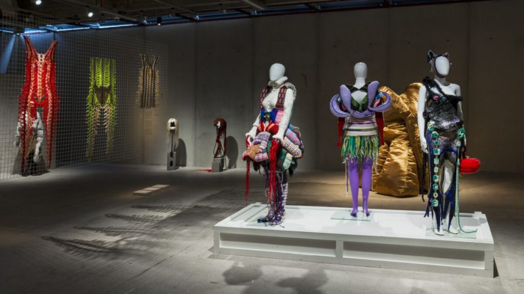 mannequins on display wearing soft tube shaped sculptural pieces